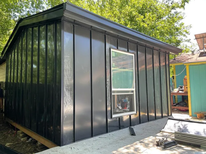 Black standing seam metal wall panels for Roof Inspection in El Granada